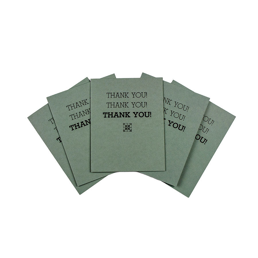 The Thank You Card - Blue, Set of 5 features hand-printed cards with repeated “THANK YOU!” in black and a QR code below, arranged fan-style. Inspired by Greenfield Village, these cards stand out on a crisp white background.