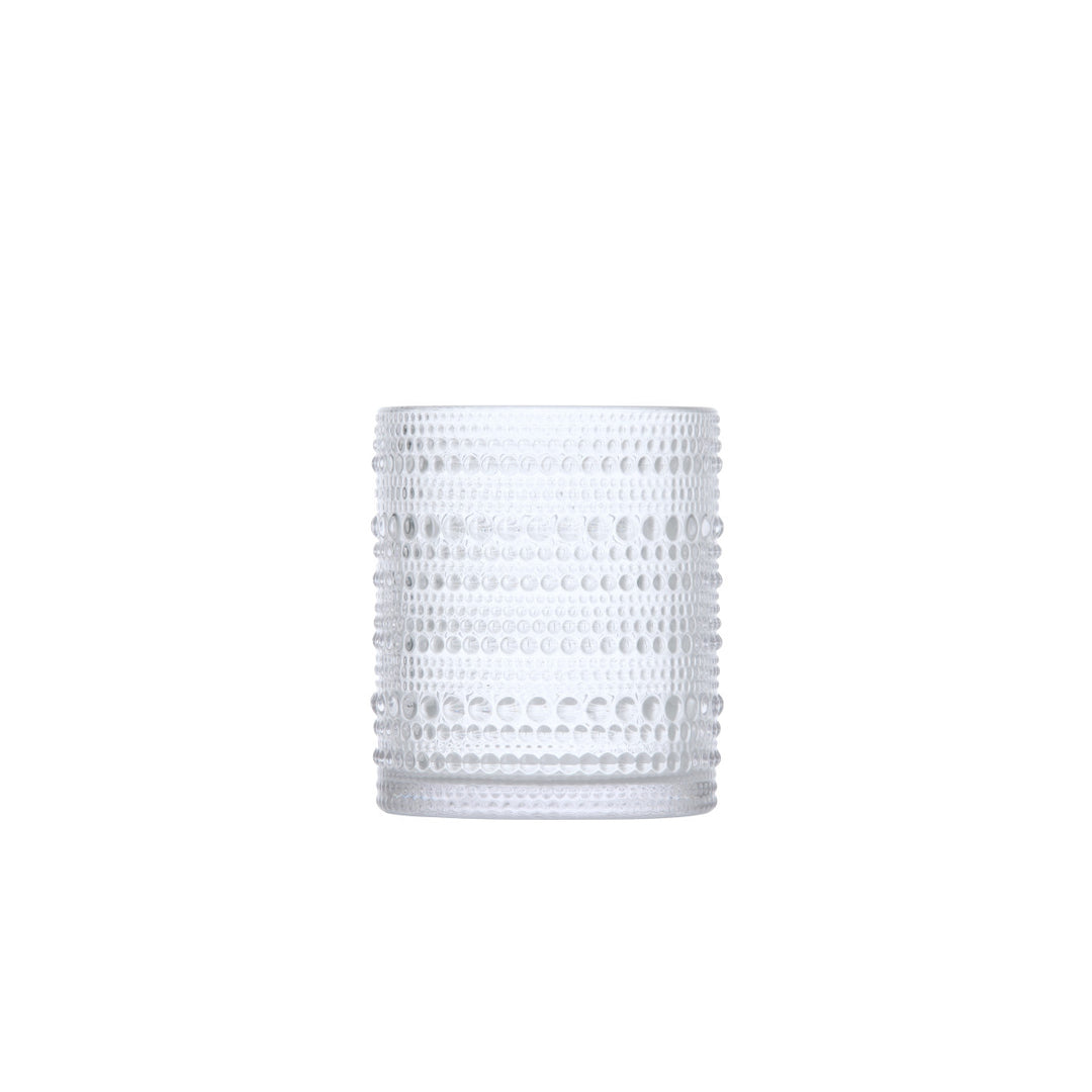 A clear Jupiter Old Fashioned Glass with a textured surface featuring horizontal rows of raised dots, shown on a white background.